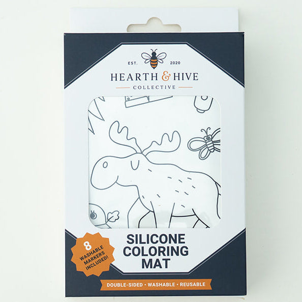 A boxed silicone coloring mat by Hearth of Hive, shown upright on a plain white background. The package is mostly white with dark navy panels and line-art illustrations of animals, with an orange badge near the bottom.