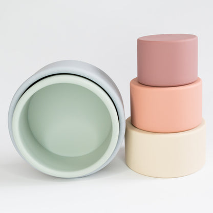 rainbow stacking cups side by side
